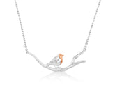 Sterling silver necklace with a charm of a robin perched on a branch, with an adjustable chain.